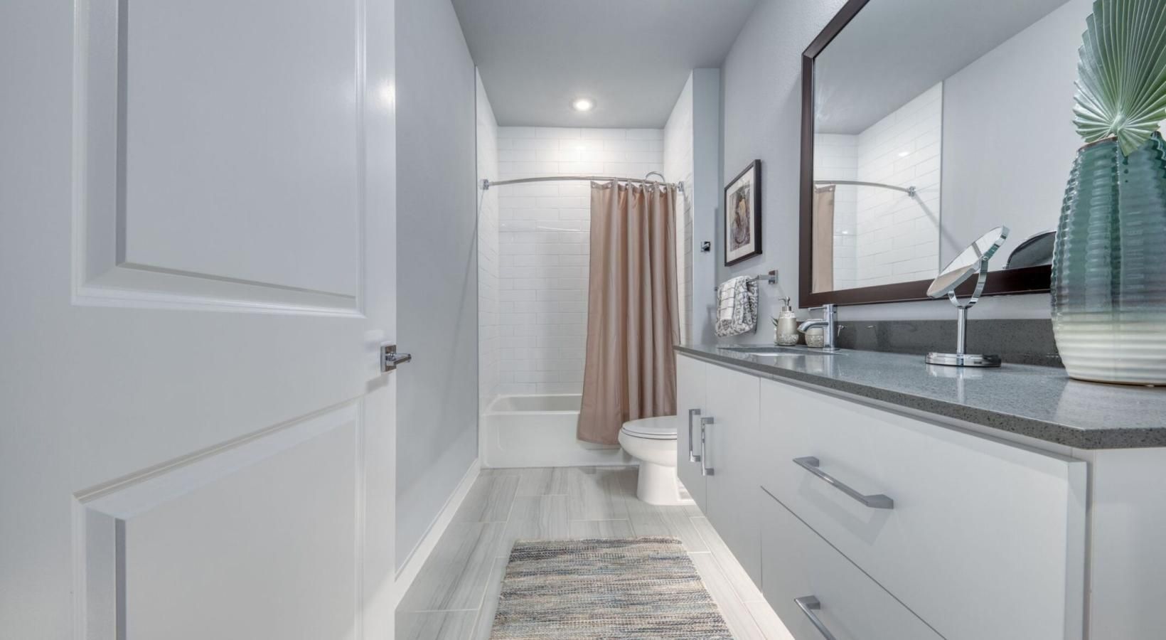 a bathroom with a large mirror
