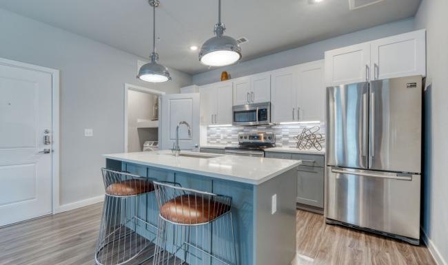 a kitchen with white cabinets